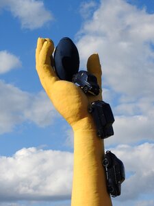 Yellow hand sculpture car