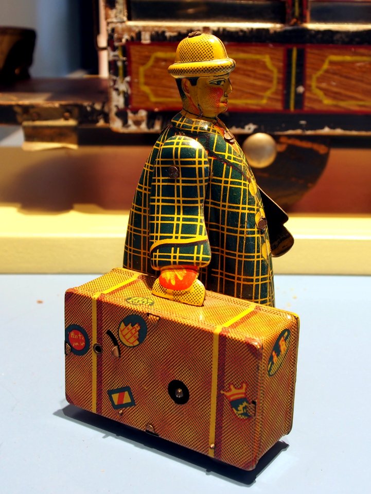Speelgoedmuseum Deventer, clockwork wind-up tin toy, traveler with suitcase