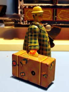 Speelgoedmuseum Deventer, clockwork wind-up tin toy, traveler with suitcase