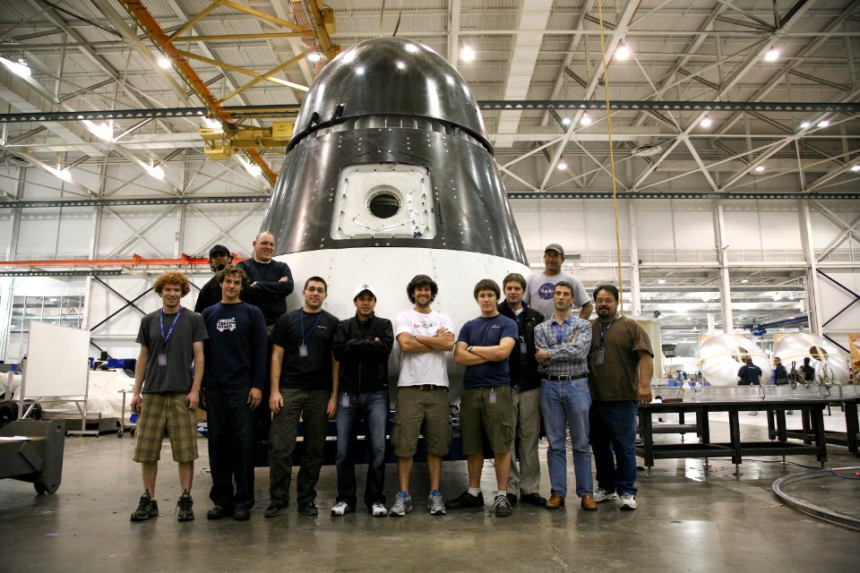 SpaceX engineers around a Dragon qualification unit