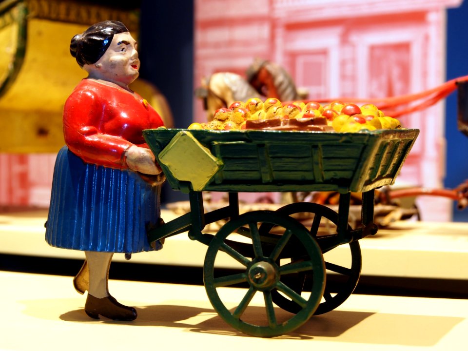 Speelgoedmuseum Deventer, clockwork wind-up tin toy, woman with handcart