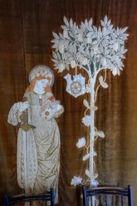 St. Catherine wall hanging, designed by William Morris for Red House, worked by Jane Morris, 1860-1861, wool threads on linen ground, appliqued onto velvet - Kelmscott Manor - Oxfordshire, England - DSC09990