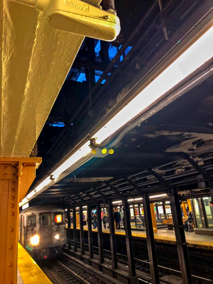 Street grating seen from below in 34th st Subway station