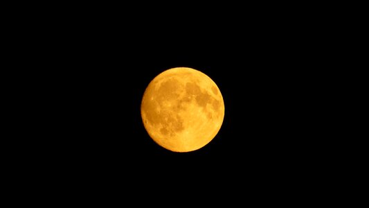 Month nearly full moon orange