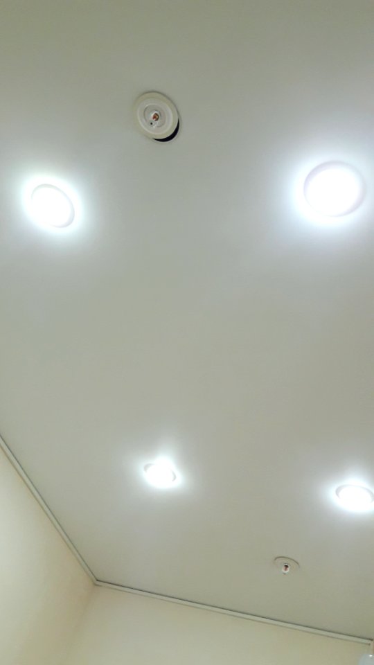 Stretched ceiling with fire sprinklers