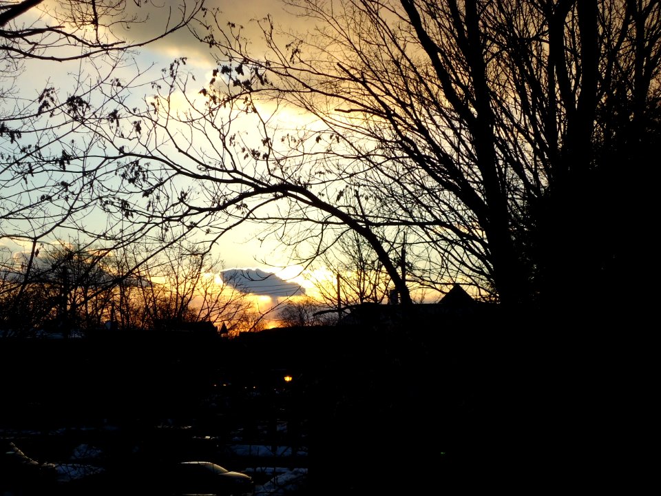 Sunset Summit NJ looking westwards cloudy sky branches cars