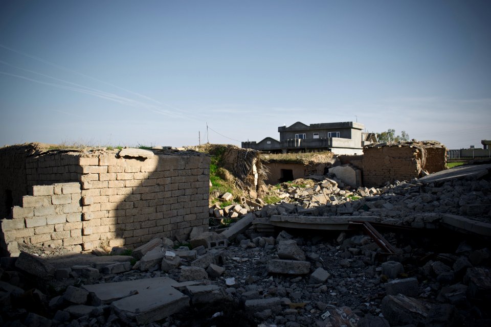 Survivors in the rubble of destruction by the Islamic State in the village Wardik 16