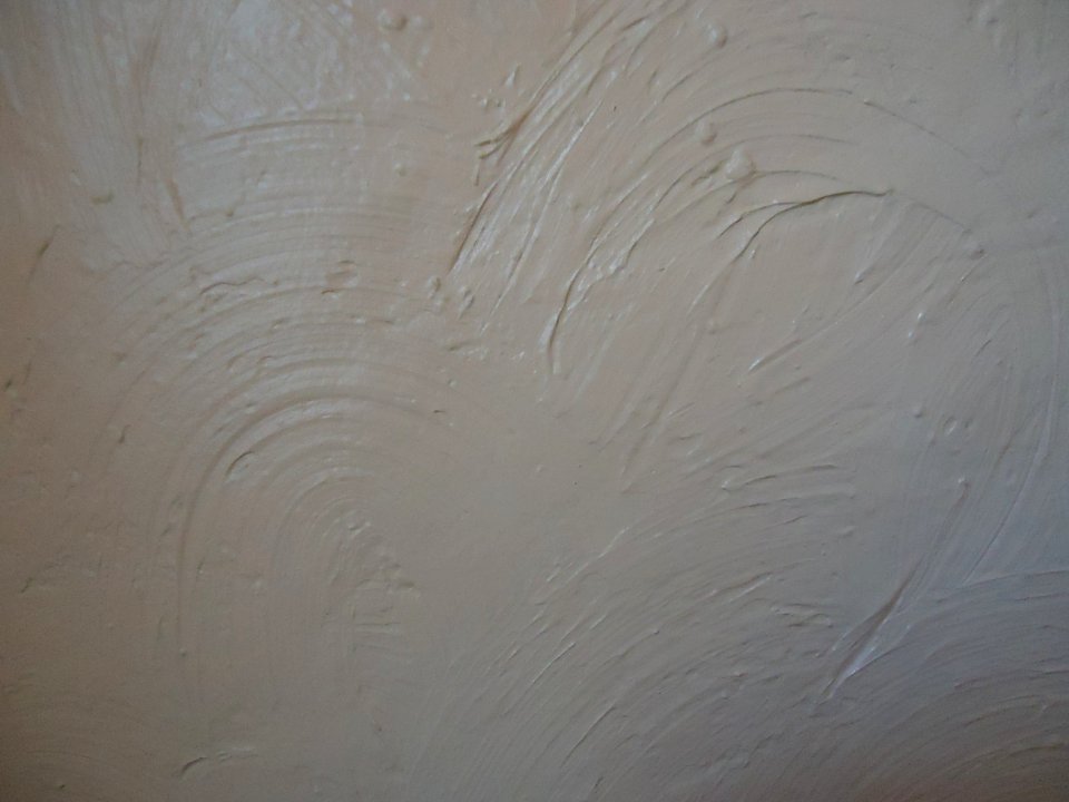 Surfaces painted wall in swirl pattern