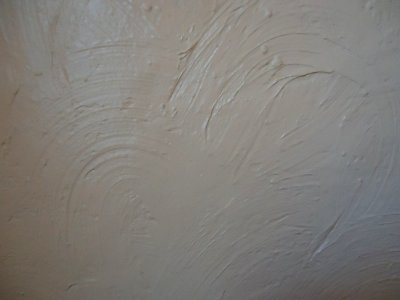 Surfaces painted wall in swirl pattern