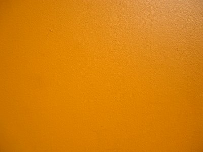 Surfaces exterior wall of a restaurant painted orange closeup view photo