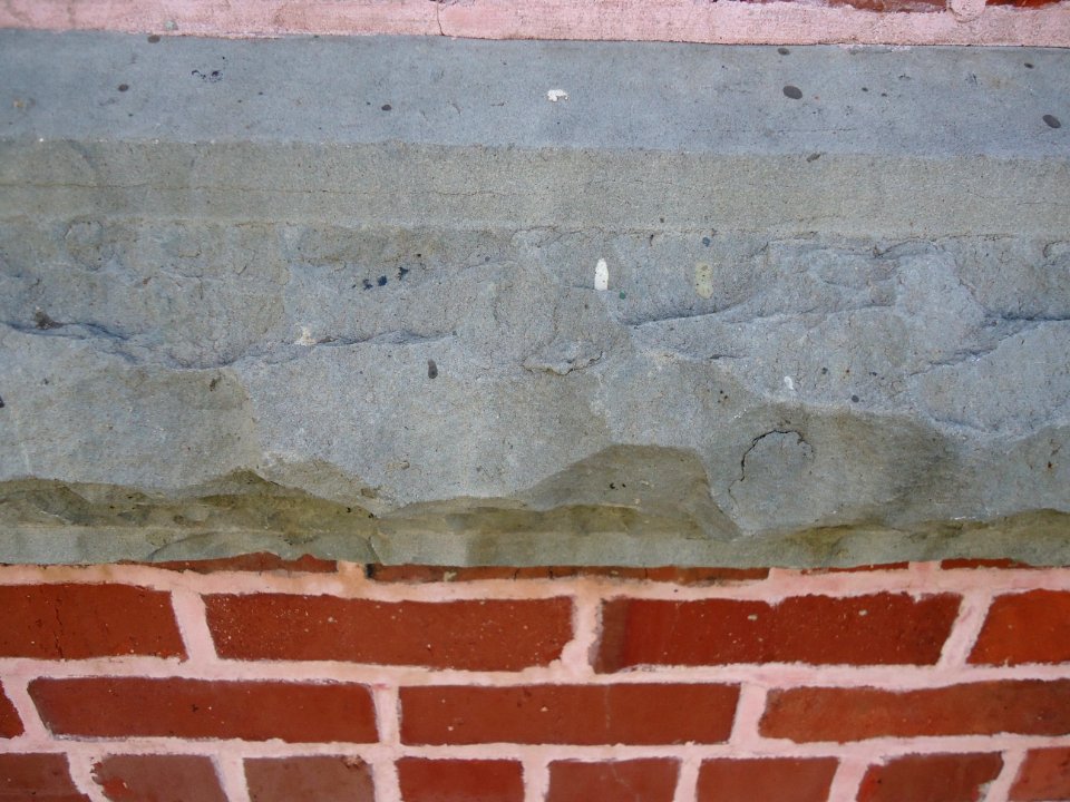 Surfaces vertical brick wall stone and brick closeup view