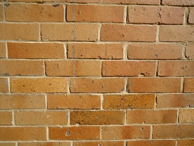 Surfaces vertical brick wall closeup view photo