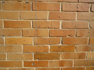 Surfaces vertical brick wall closeup view