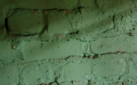 Surfaces painted brick in a basement photo
