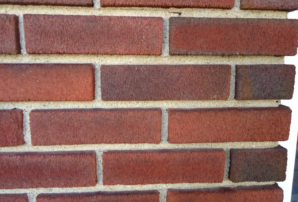 Surfaces brick wall with mortar closeup view