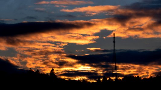 Sunset behind a telecom tower photo