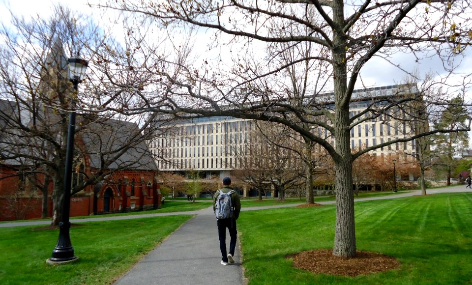 Students on paths near lawn at Cornell University