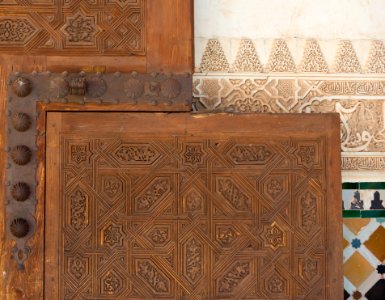 Stucco, wooden door, mosaics, wall Alhambra, Granada, Spain photo