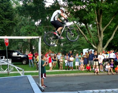 Stunt bicyclist Chris Clark does aerial jump in demonstration in Summit NJ photo