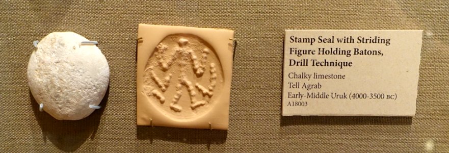 Stamp seal with Striding Figure Holding Batons, Drill Technique, Tell Agrab, Early-Middle Uruk, 4000-3500 BC, chalky limestone - Oriental Institute Museum, University of Chicago - DSC07201