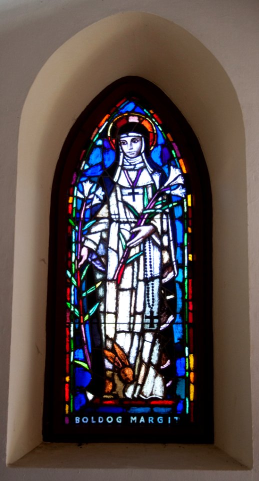 Stained glass window in the Galyatető Roman Catholic church with Saint Margaret
