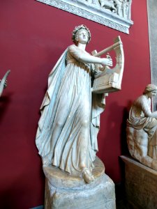 Statue of a female playing a harp in the vatican museum pic1