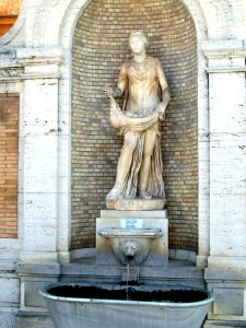 Statue with drinking fountain in the Vatican museum