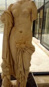 Statue of chaste goddess Venus accompanied by love figurine