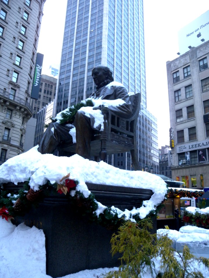 Statue Greeley Sq snow jeh