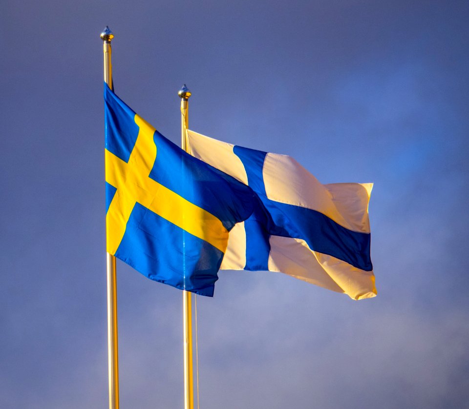 Swedish and Finnish flag flying in front of Ikea Raisio, Finland