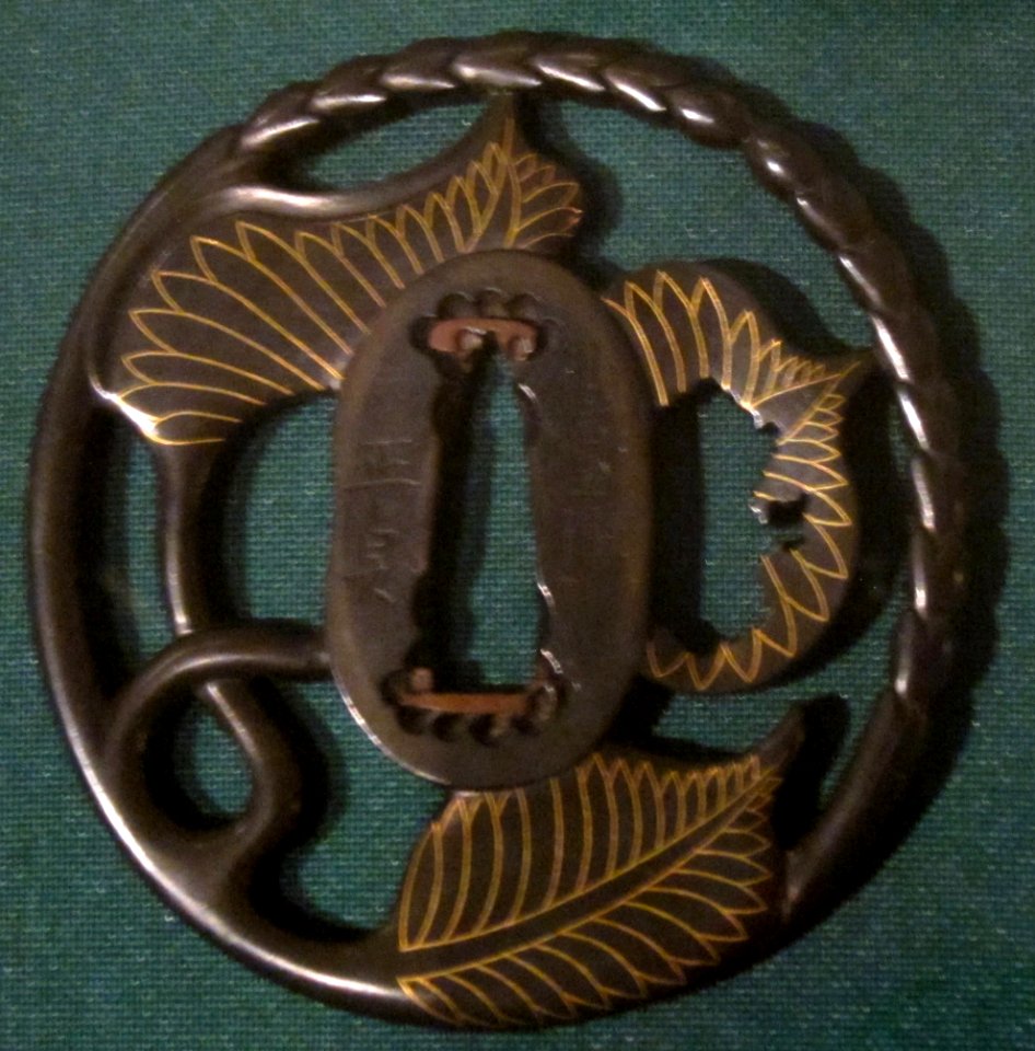 Sword guard (tsuba) with hollyhock leaves and stems signed Masasada