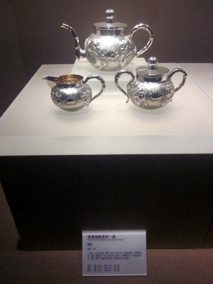 Tea Set with Two-dragons-copping a gem Design, the late Qing Dynasty, Changsha Museum