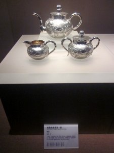 Tea Set with Two-dragons-copping a gem Design, the late Qing Dynasty, Changsha Museum