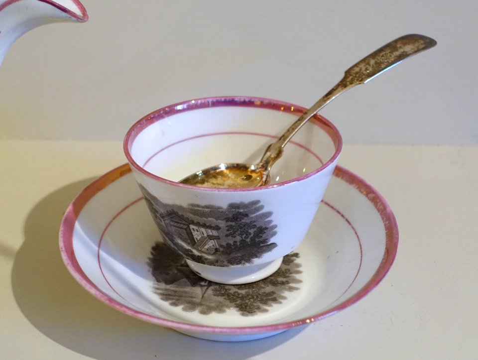 Teacup and saucer, England, mid to late 1800s, earthenware with pink-luster glaze, teaspoon by G. Baker, Providence RI, c. 1825, silver - Concord Museum - Concord, MA - DSC05767