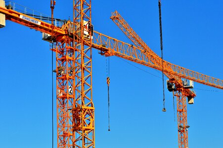 Crane arm lift loads construction work photo