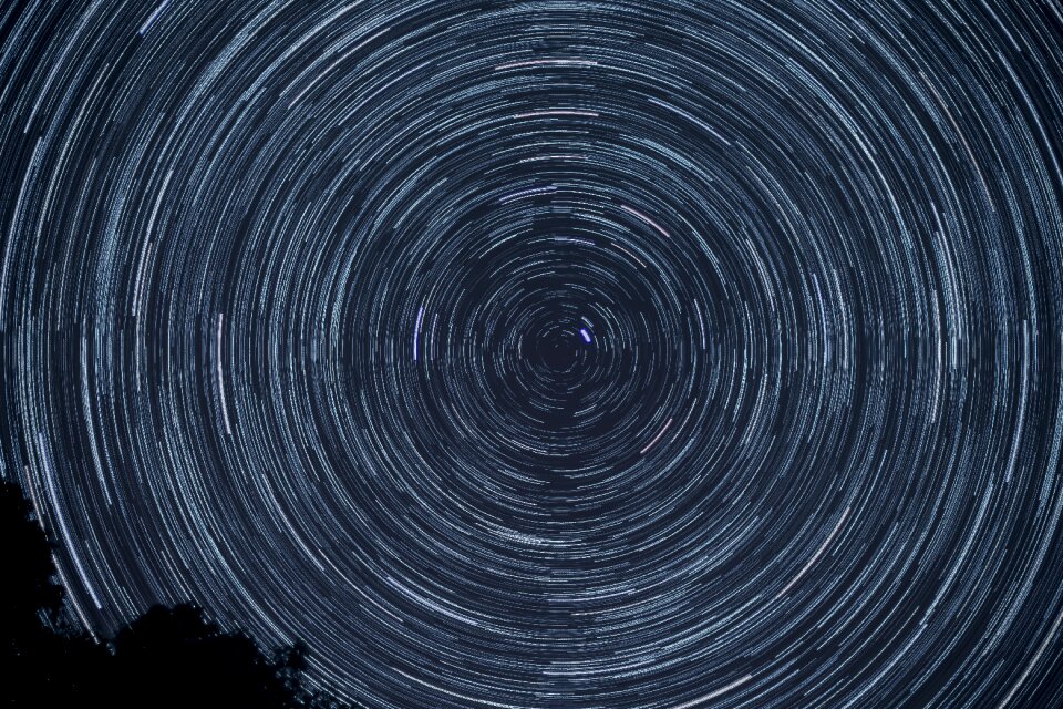 Starry sky star trail dark photo