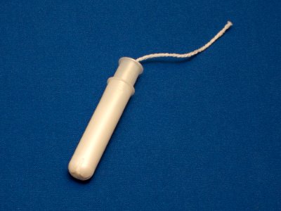 Tampon with plastic applicator