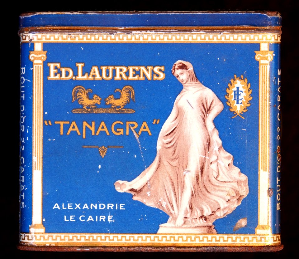Tanagra cigarettes tin with side descriptions, front