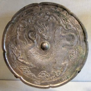 Tang dynasty bronze mirror with dragon and clouds design
