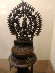 Temple lamp showing Bhairav and Ganesh photo