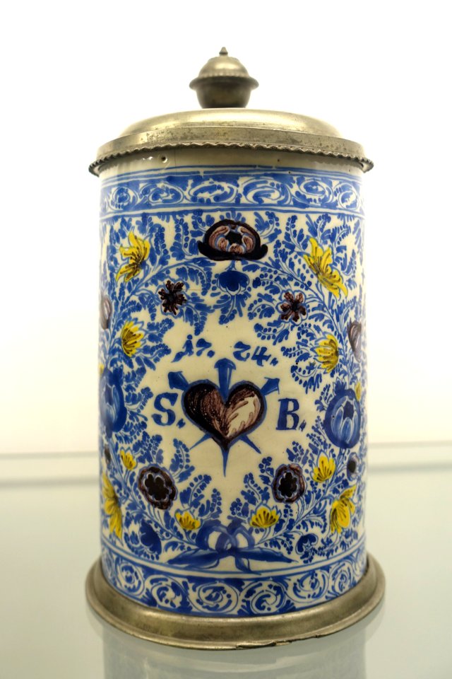 Tankard with Heart of Christ motif within a decoration of flowers, birds, and leaves, tin mounting by Nicolaus Possinger, Nuremberg, 1724, earthenware - Stadtmuseum Fembohaus - Nuremberg, Germany - DSC02284