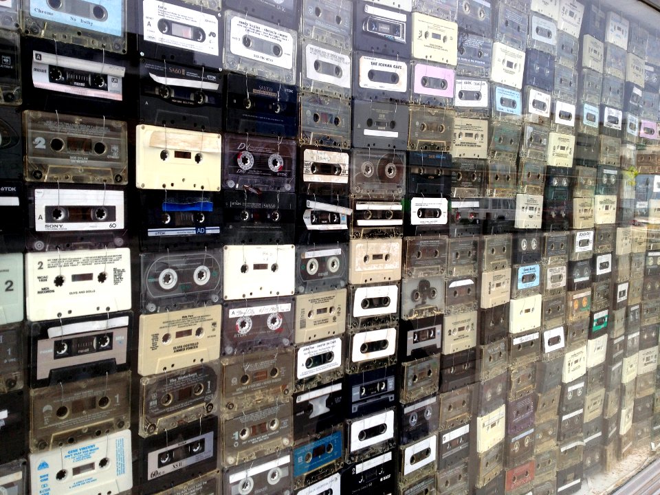 Tape cassettes in a wall display