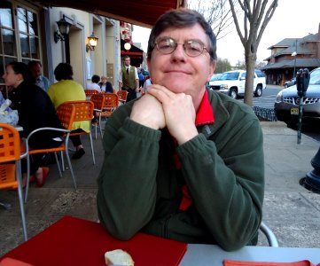 Tom Sulcer sitting at an outdoor restaurant in Summit New Jersey