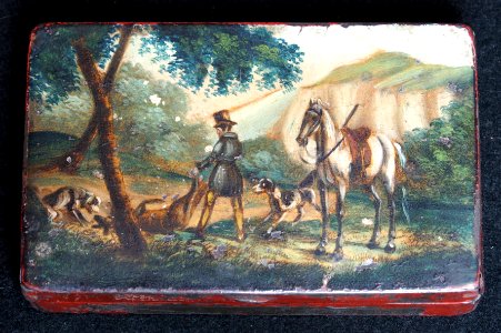 Tin depicting a hunter