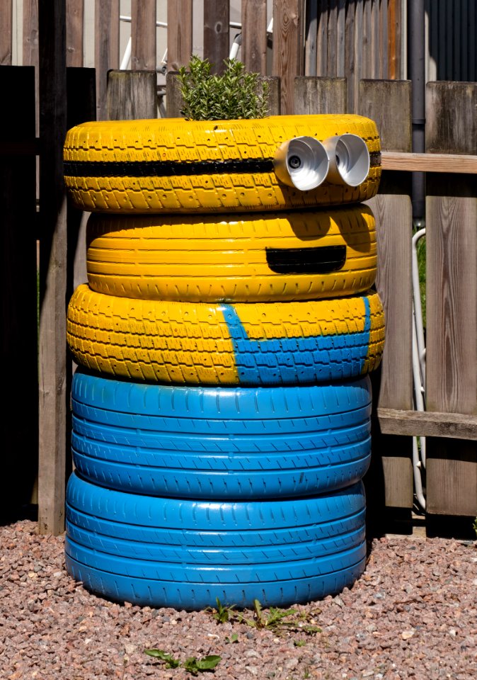 Tires recycled as a minion garden art 2