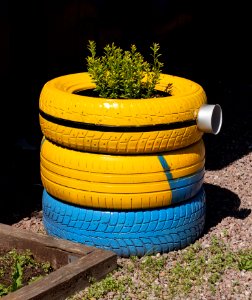 Tires recycled as a minion garden art 1