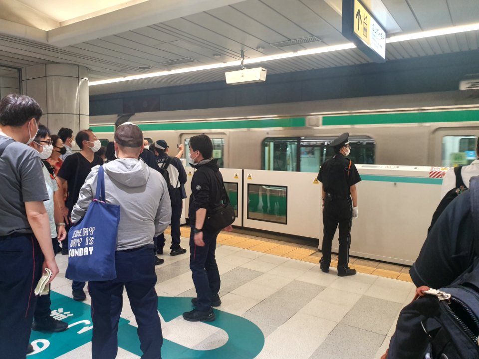Tokyo 2020 Olympics in Ariake, security personel leaving from Kokusai-Tenjijo station