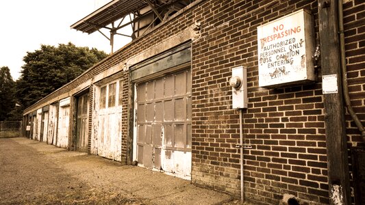 No trespassing brick building photo