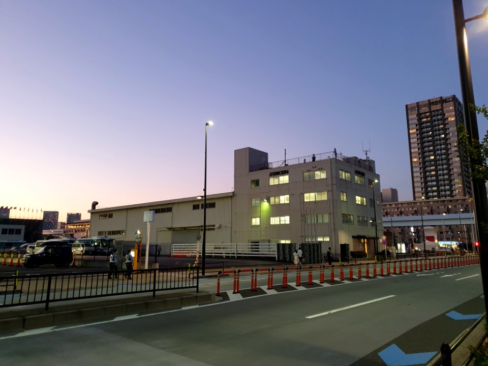 Tokyo 2020 Olympics in Ariake, police watching on top of industrial building in front of tennis center court