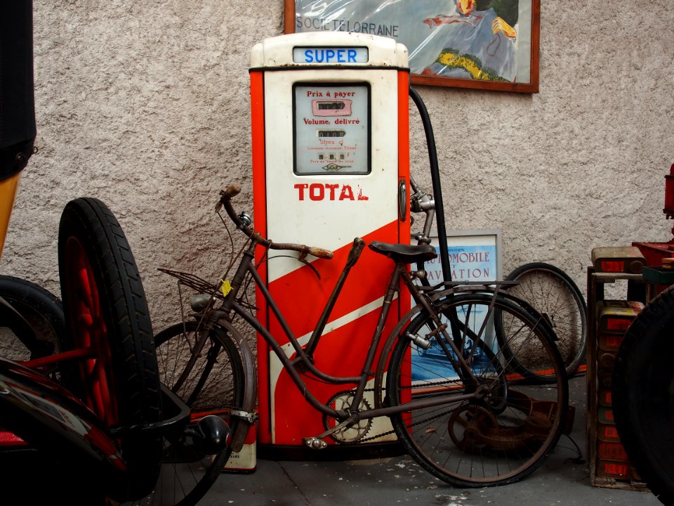 Total, old petrol pump with bicycle parked in front of it, pic3
